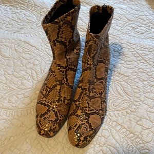 Faux snakeskin ankle boots.